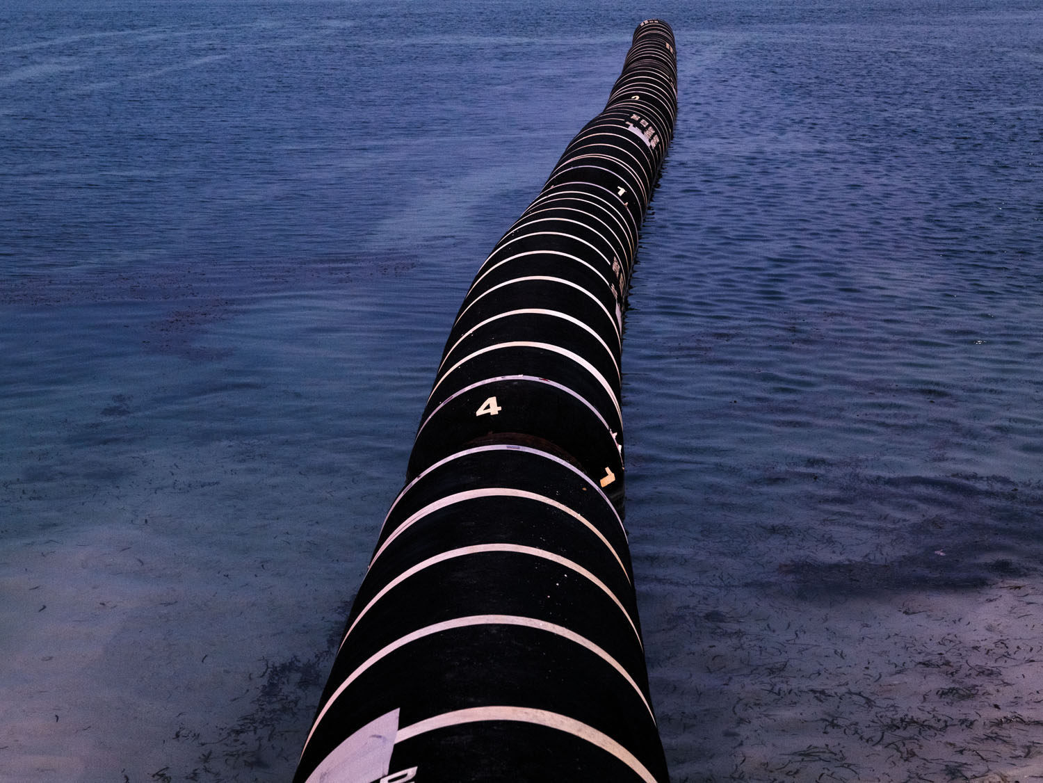 Dredge pipe for an airport runway project on Muli island.