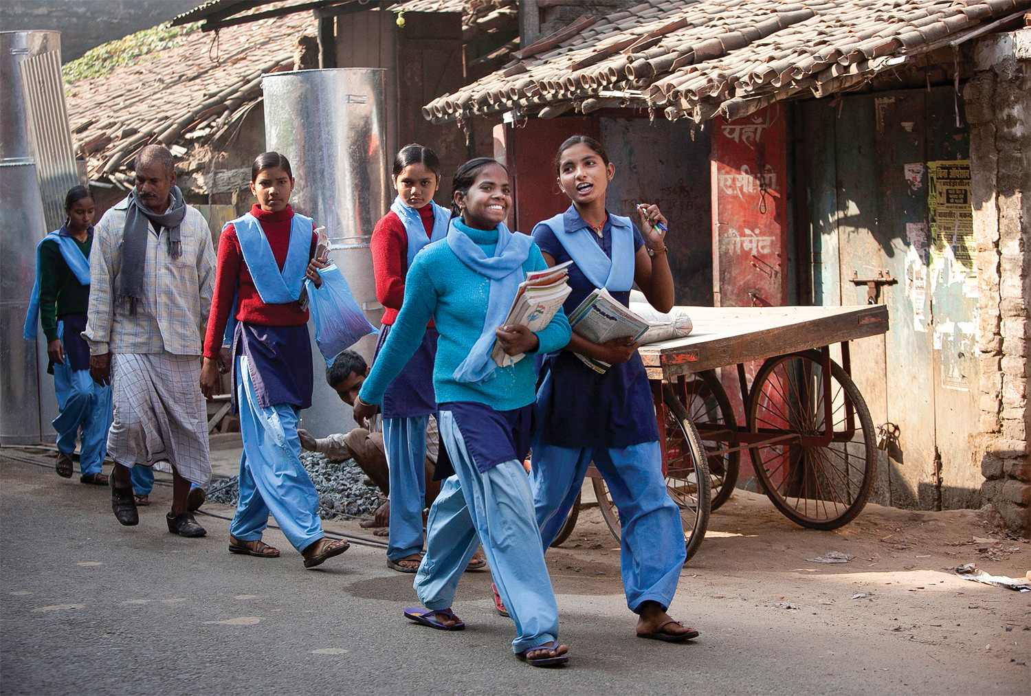 Girls walking to school through the town center in rural Bihar, 2013. (All photographs by Allison Joyce/Redux)